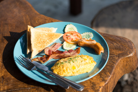 breakfast with fried eggs, bacon,toastの写真素材
