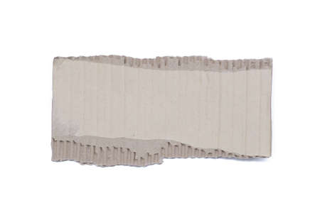 corrugated cardboard torn and isolated on whiteの写真素材