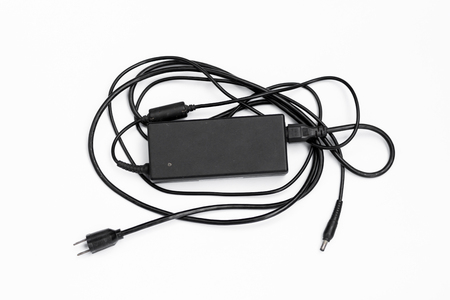 Laptop AC adapter isolated on white background