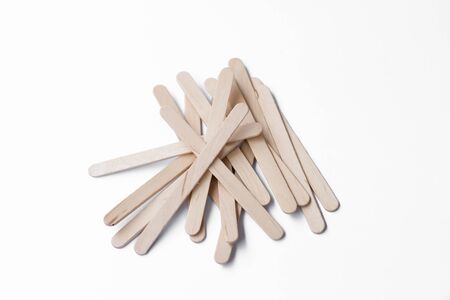Wooden ice-cream sticks on white backgroundの写真素材