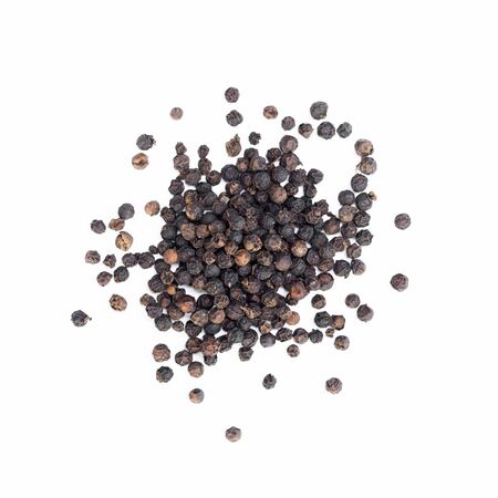 Black pepper on a white backgroundの写真素材
