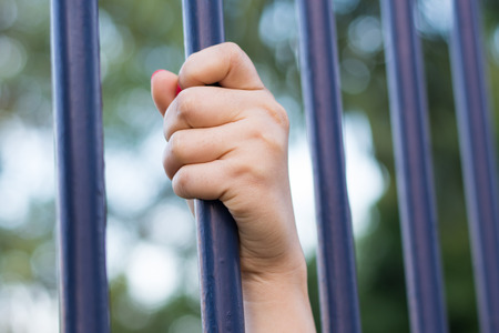 woman hand holding iron bar