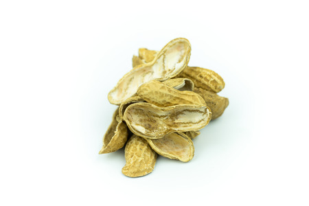 Dried peanuts isolated on whiteの写真素材