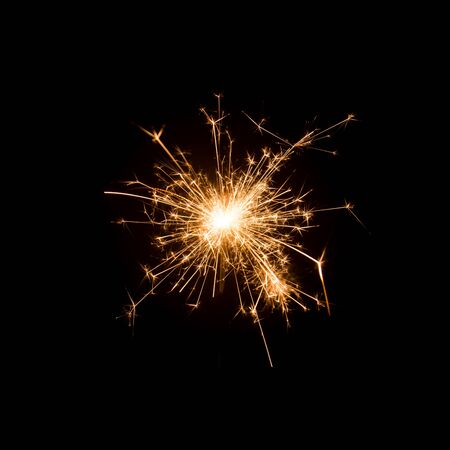 Burning sparkler isolated on black backgroundの写真素材