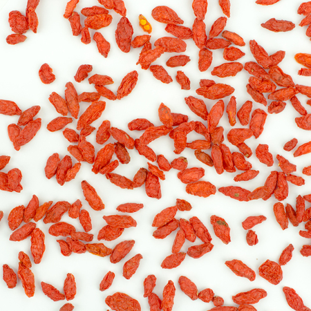 heap of goji berries isolated on white backgroundの写真素材