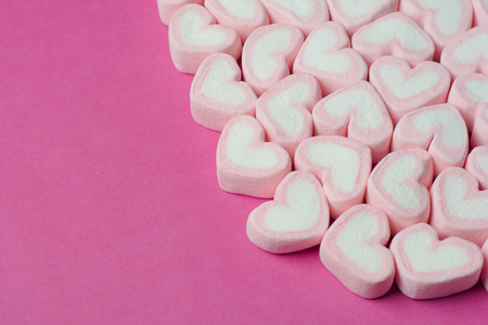 Pink heart shaped marshmallows backgroundの写真素材