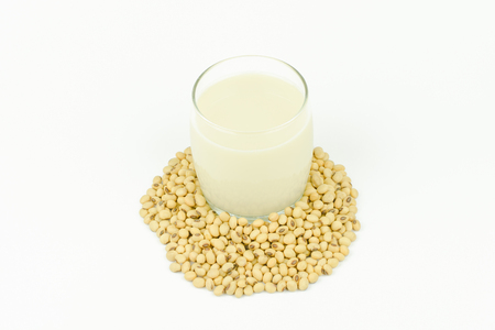 Milk with soy beans on white background.の写真素材