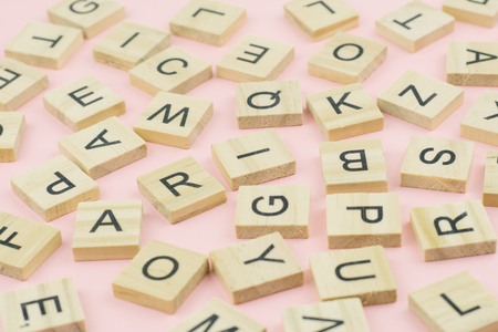 background of  letterpress wood type printing blocks, random letters of alphabet and punctuation...