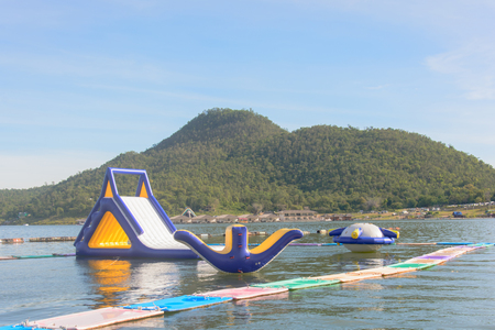 inflatable water park on the lake with The mountain in the background,kanchanaburi,thailandのeditorial素材