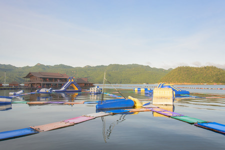 inflatable water park on the lake with The mountain in the background,kanchanaburi,thailand