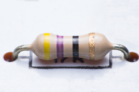Closeup electronic hardware .Resistor on the white circuit boardの写真素材