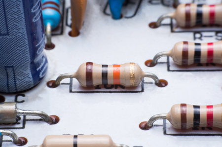 Closeup electronic hardware .Resistor on the white circuit boardの写真素材