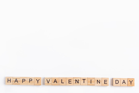 Alphabet letter wooden blocks tiles Valentine`s day on white background, Valentine concept, copy...
