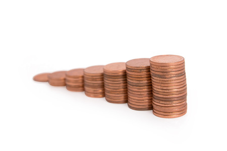 Stacks of copper coins isolated on white background