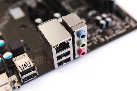 Lan socket RJ 45 and Audio output socket on computer motherboard isolated on white backgroundの写真素材