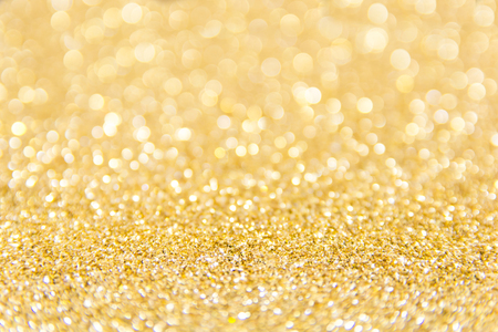 gold glitter defocused texture background. gold christmas abstract backgroundの写真素材