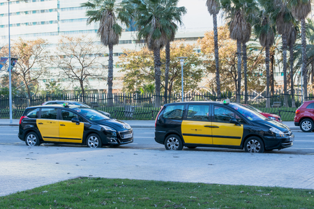 Barcelona, Spain - March 18, 2018: Taxi cars on the street of Barcelonaのeditorial素材