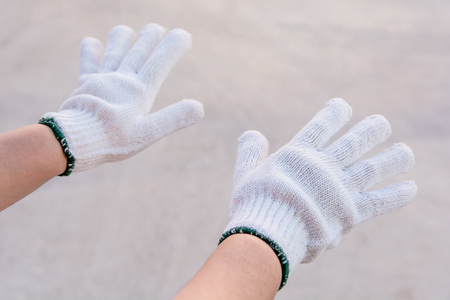 White cotton gloves on woman handの写真素材