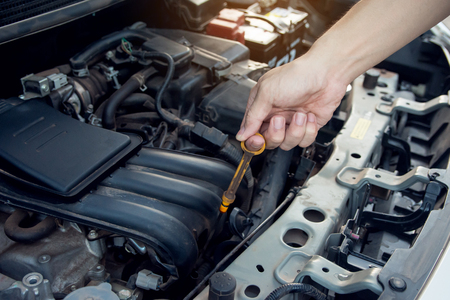 Car mechanic working with wrench in garage. Repair service.の写真素材