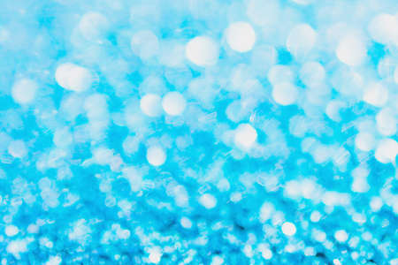 Defocused blue glitter background. blue abstract bokeh background. Christmas abstract backgroundの写真素材