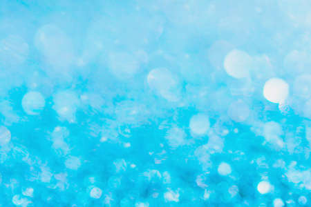 Defocused blue glitter background. blue abstract bokeh background. Christmas abstract background