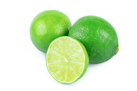 Lime with slices half isolated on white background. Green citrus fruit.の写真素材
