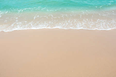 Summer beach concept - Soft wave of sea on empty sandy beach Background with copy space