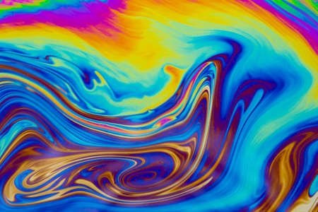 Psychedelic multicolored patterns background. Photo macro shot of soap bubbles