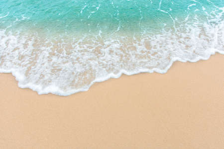 Summer beach concept - Soft wave of sea on empty sandy beach Background with copy space