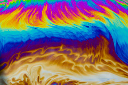 Psychedelic multicolored patterns background. Photo macro shot of soap bubbles