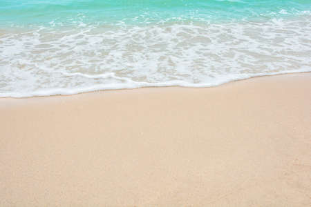 Summer beach concept - Soft wave of sea on empty sandy beach Background with copy spaceの写真素材
