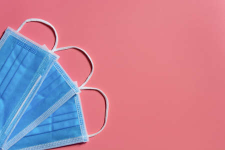 Medical mask on pink background Covid 19 protection. With clipping pathの写真素材