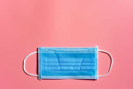Medical mask on pink background Covid 19 protection. With clipping path