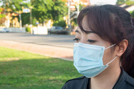 Asian woman wear medical mask that protects of coronavirus or COVID-19 disease.の写真素材