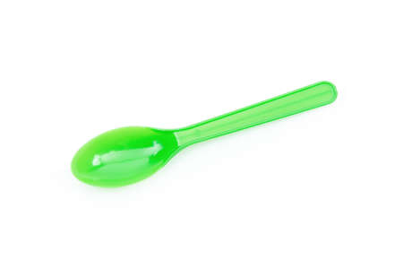 Green plastic spoon isolated on white backgroundの写真素材