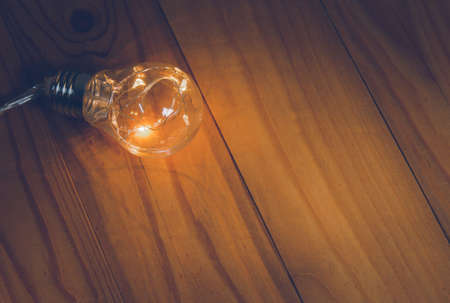 Light bulbs over wooden background