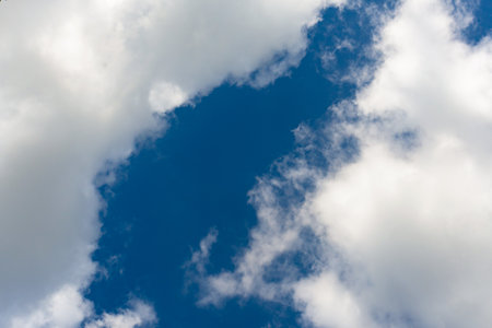 Cirrus and cumulus clouds on blue sky background.の写真素材