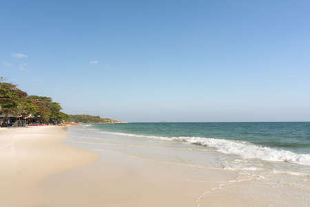 Beach and waves tropical sea with blue sky on sunny day background. copy spaceの写真素材