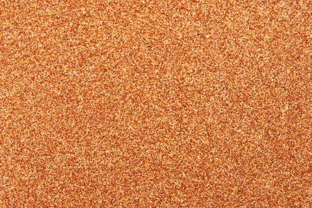 Orange glitter texture backgroundの写真素材