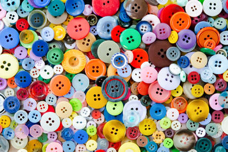 Colorful mixed sewing buttons background. Top viewの写真素材