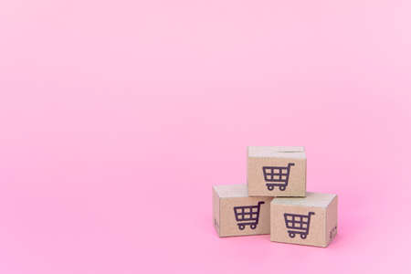 Shopping concept : Cartons or Paper boxes on pink background. online shopping consumers can shop...