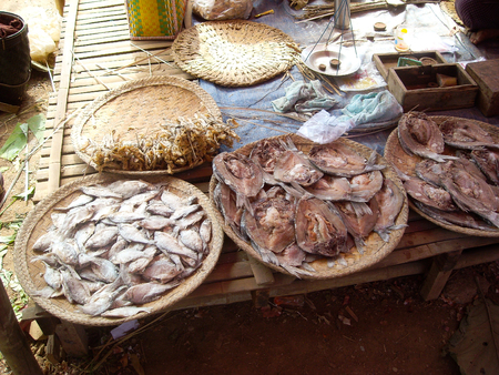 a market in burma is selling grain on the streetの写真素材