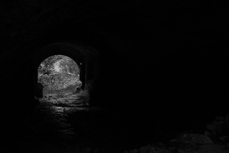 a tunnel in an old castle ruin at springの写真素材
