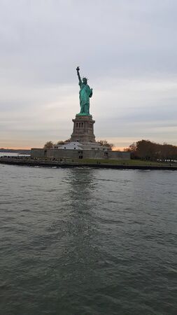 the statue of liberty at sunset  in summer