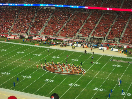 a full football stadium at the match in summer