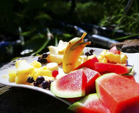 water melones on a plate in the sunの写真素材