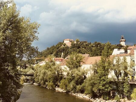 view to the clocktower in graz austria at summer