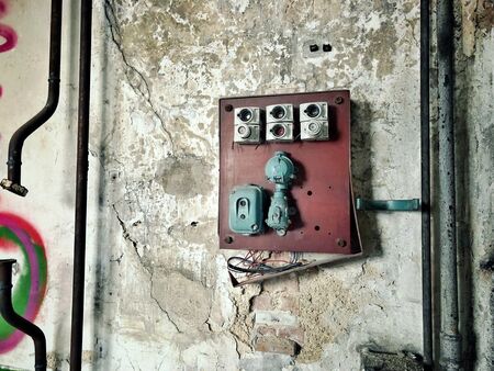 old powerlines in a factoryの写真素材