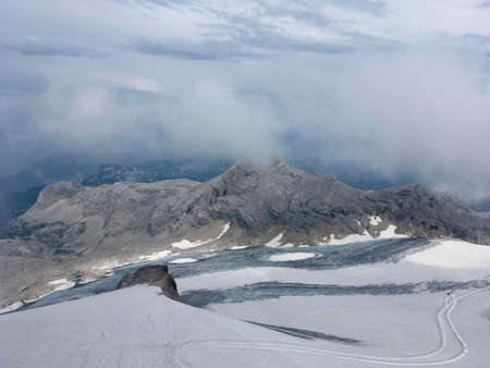 a snow capped mountain on the top on it