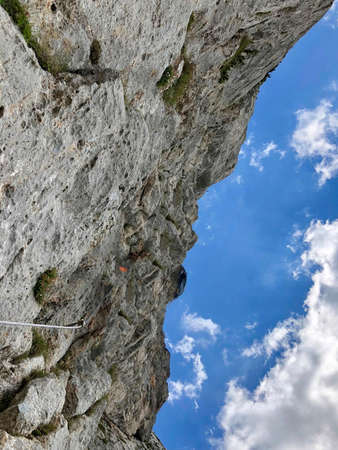 a rope on the rock for climbing on it